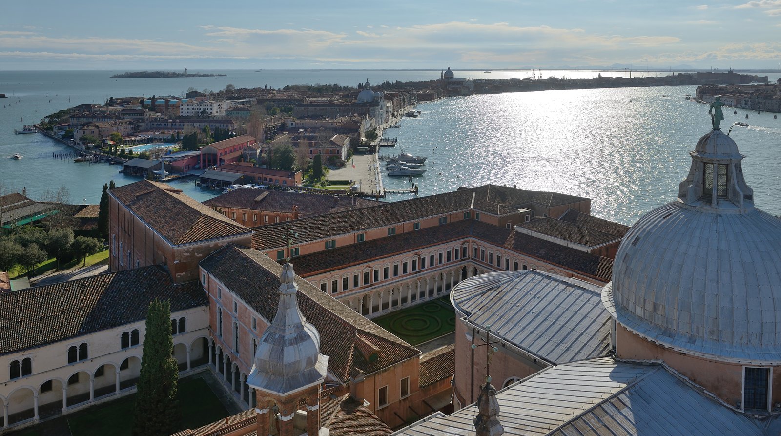 A view across open lagoon water toward Giudecca from San Giorgio Maggiore.