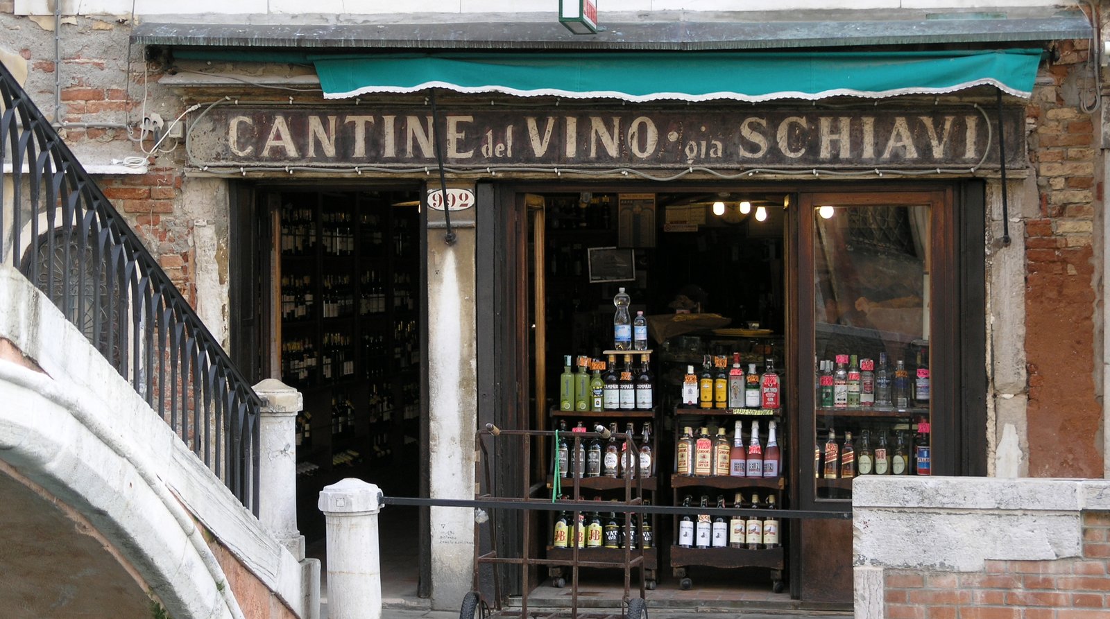 A counter of cicchetti and small dishes laid out inside a Venetian bacaro.