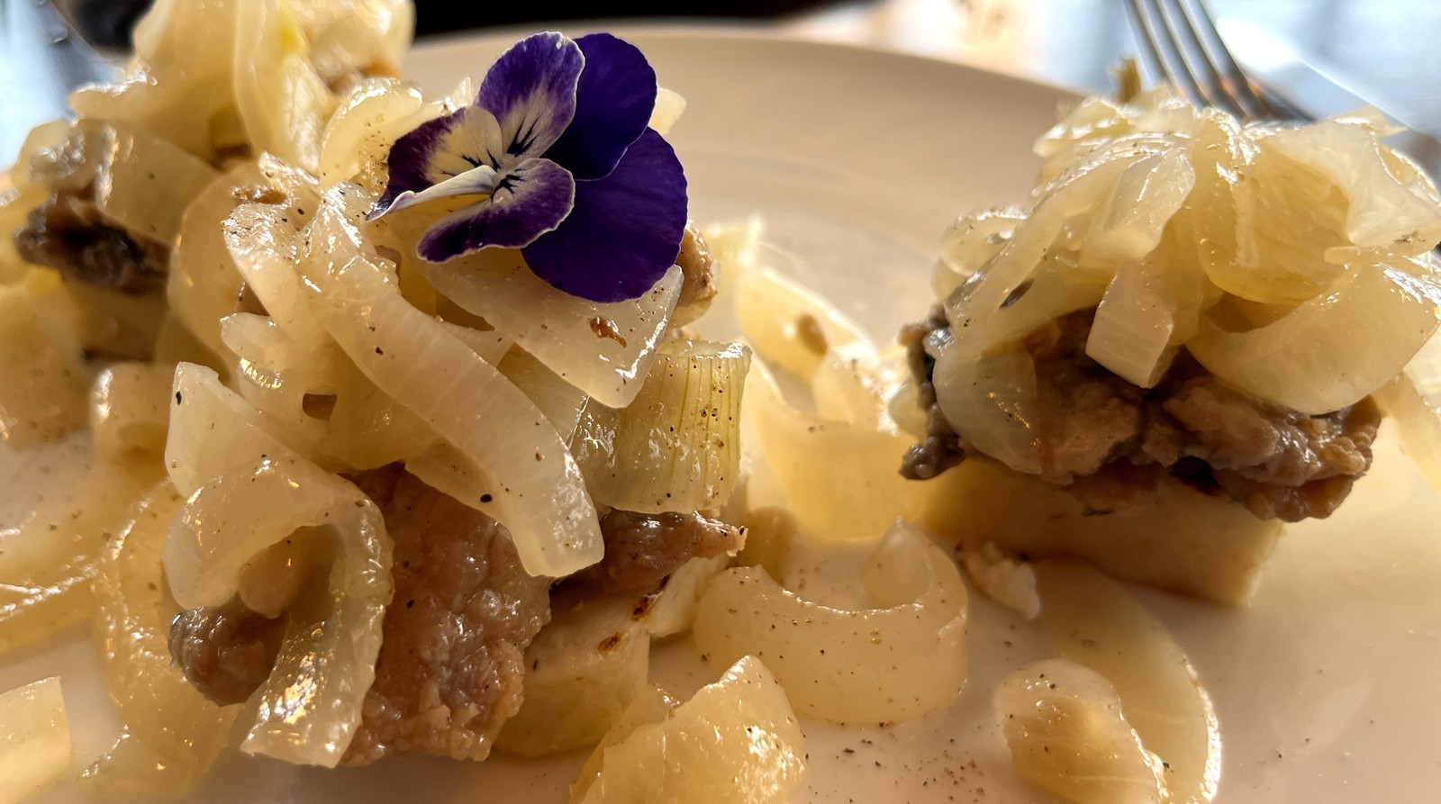 A table set with sarde in saor and other dishes shaped by Venice's Jewish community.