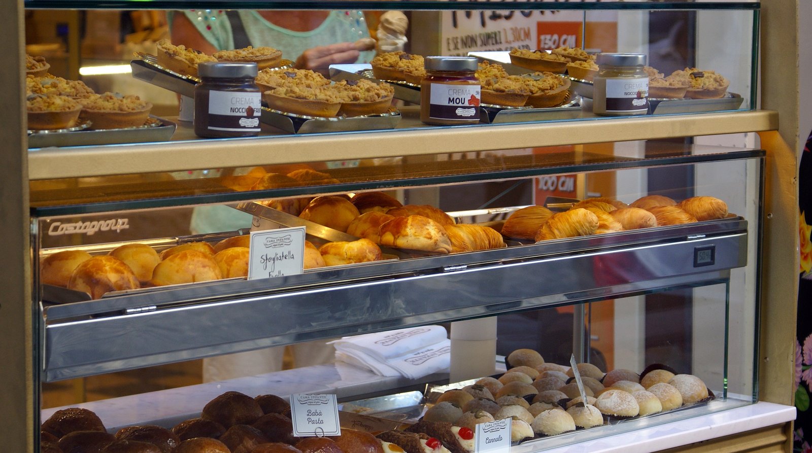A display case of traditional Italian pastries.