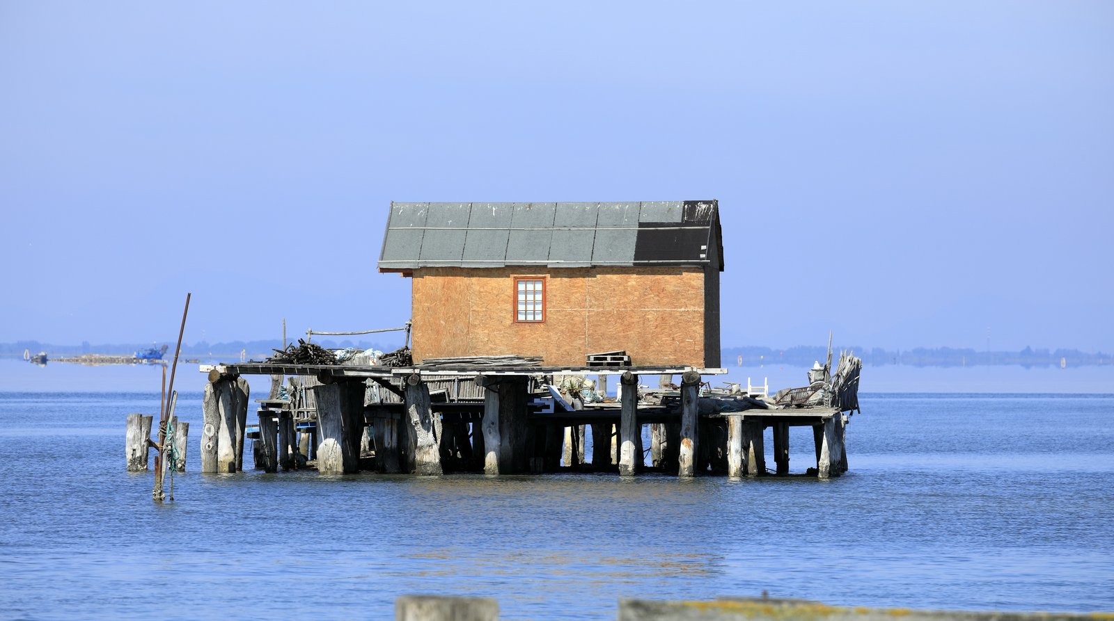 The narrow fishing island of Pellestrina, seen along its sea-wall edge.