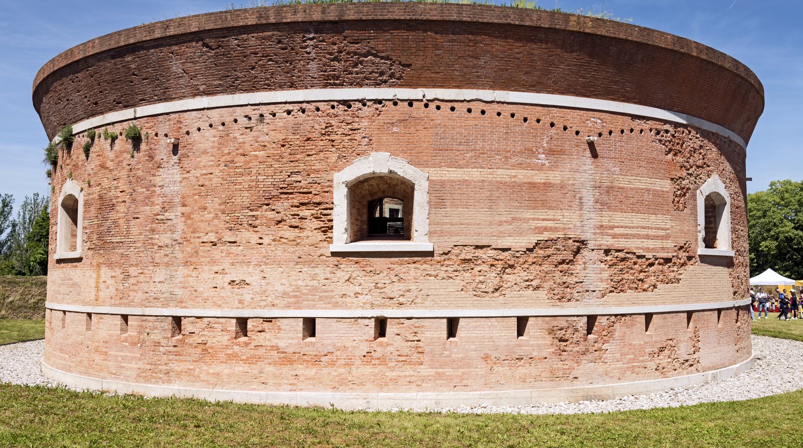 The Torre Massimiliana fortification on Sant'Erasmo, surrounded by open farmland.